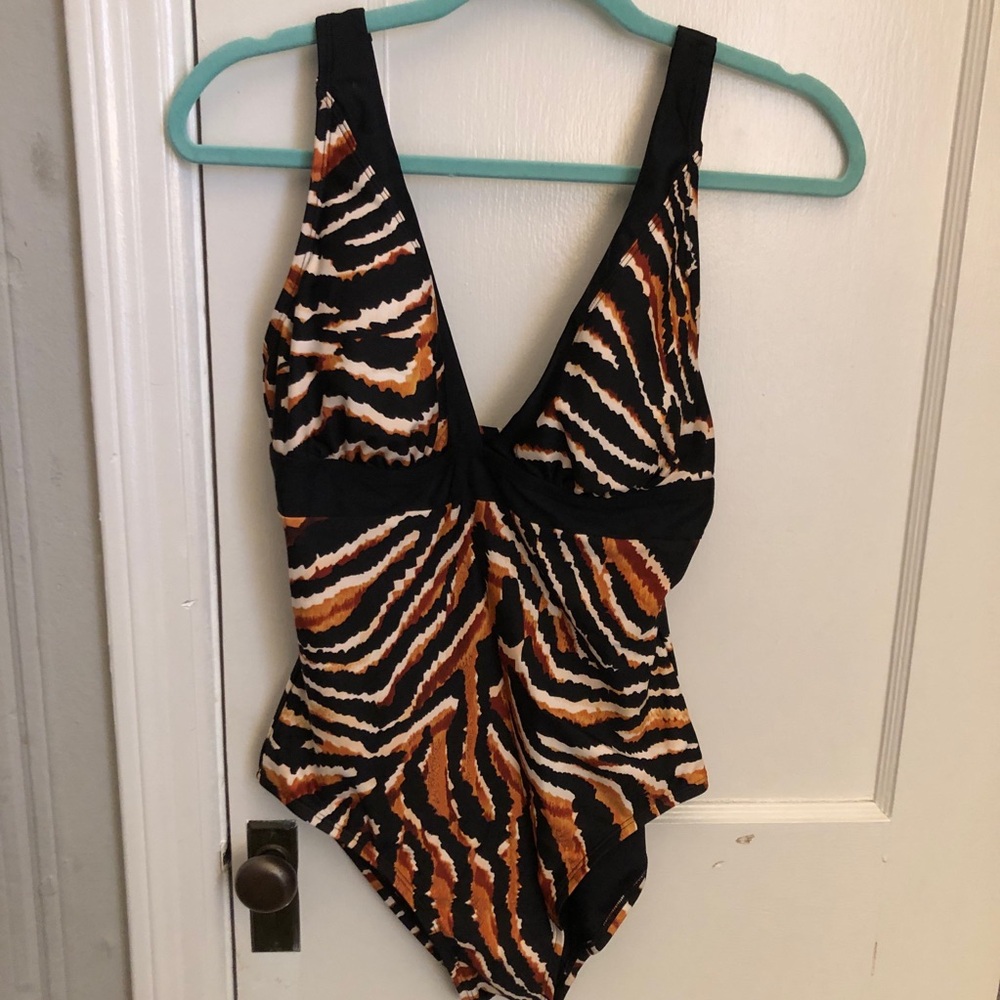 DKNY animal print one piece. New with tags. Size 10. Very flattering fit!